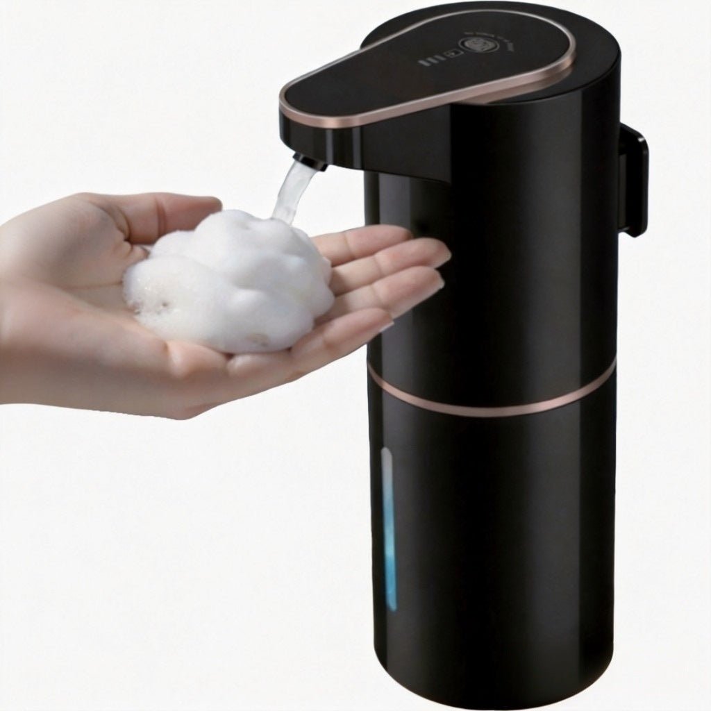 Black and rose gold soap dispenser dispensing soap into a hand against a white background