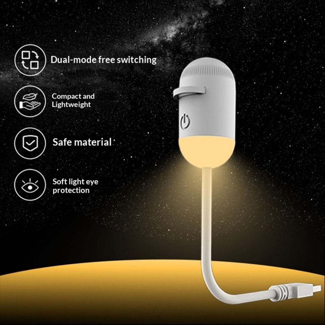 Small lamp with USB cable on a dark space-themed background