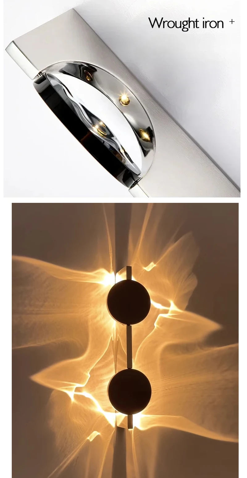 Wrought iron wall sconce with a close-up of its design.